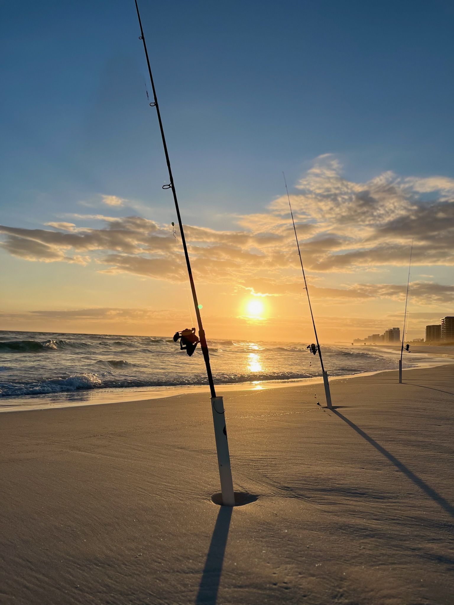 8-foot surf fishing rod at sunset on the beach