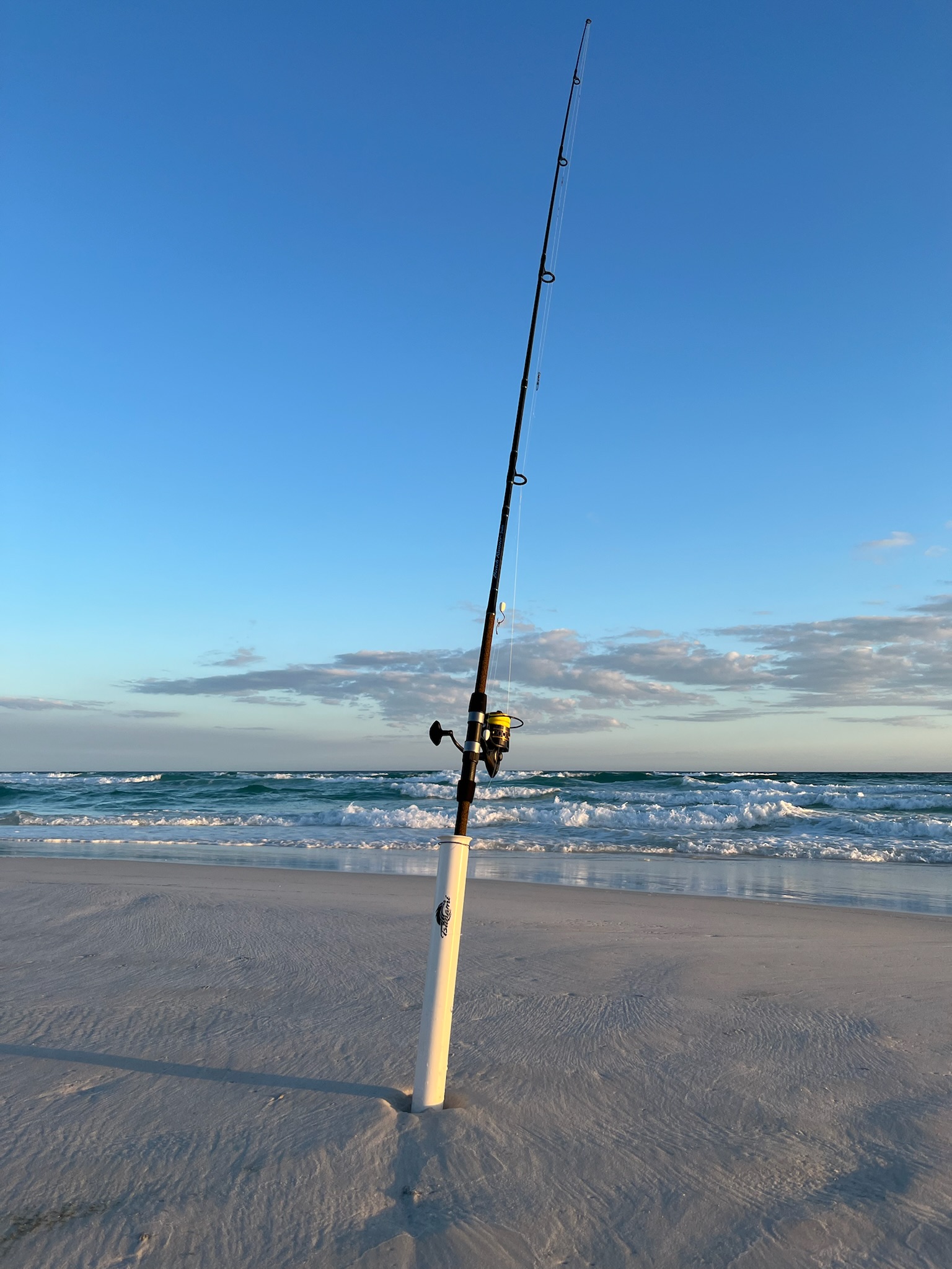 9-foot surf fishing rod set up on the beach